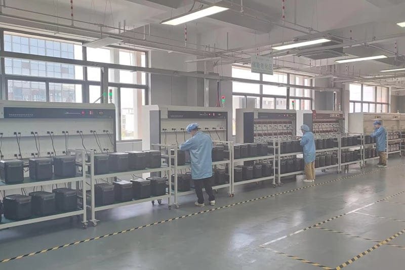Peka Power technicians conducting aging tests on portable energy systems for quality assurance