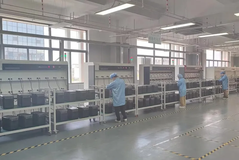 Peka Power technicians conducting aging tests on portable energy systems for quality assurance
