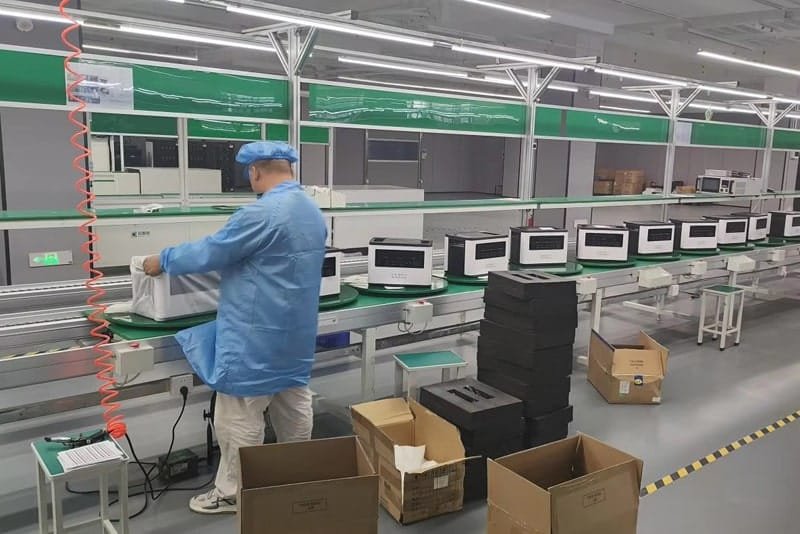 Peka Power technician performing final packaging of portable power stations on the production line