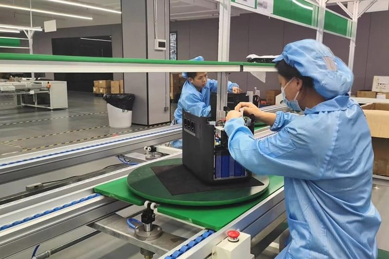 Peka Power staff assembling internal components of a portable power station on the production line