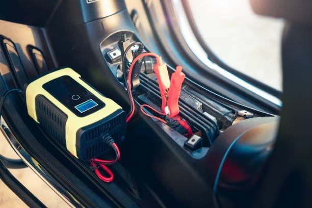 AGM battery connected to a smart charger inside a vehicle