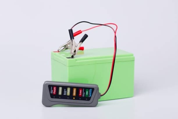 Battery health tester connected to AGM battery for performance check