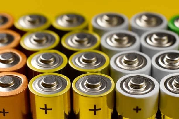 Several AA batteries arranged to create a 12V battery pack