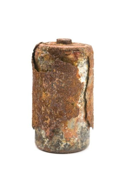 Severely corroded battery showing extensive damage from acid leak