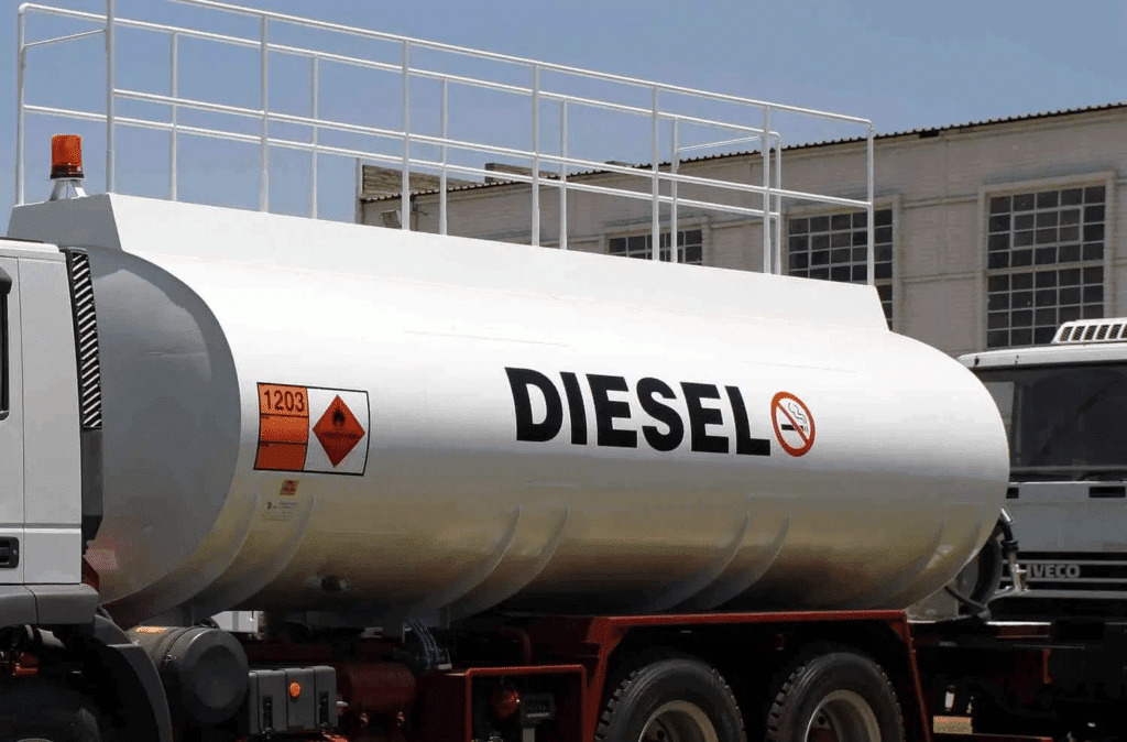 Diesel fuel delivery truck with safety markings transporting bulk diesel fuel.