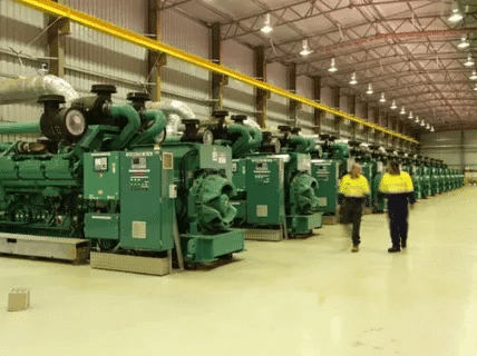 Row of diesel generators installed in a plant for industrial power supply and long service life