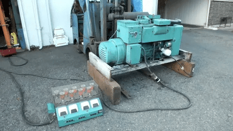 Diesel generator connected to a load bank for proper load testing and prevention of wet stacking