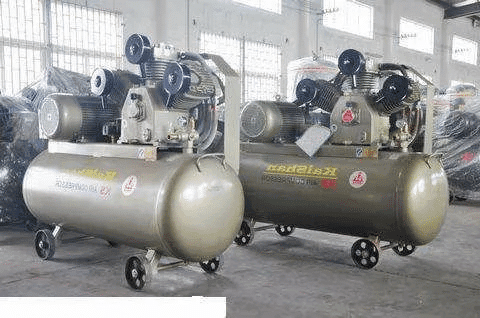 Large twin tank industrial air compressors designed for factory and workshop applications.