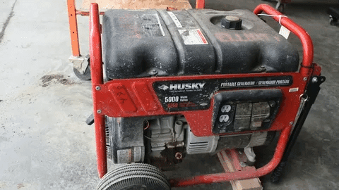 Husky 5000 watt portable generator in a garage.